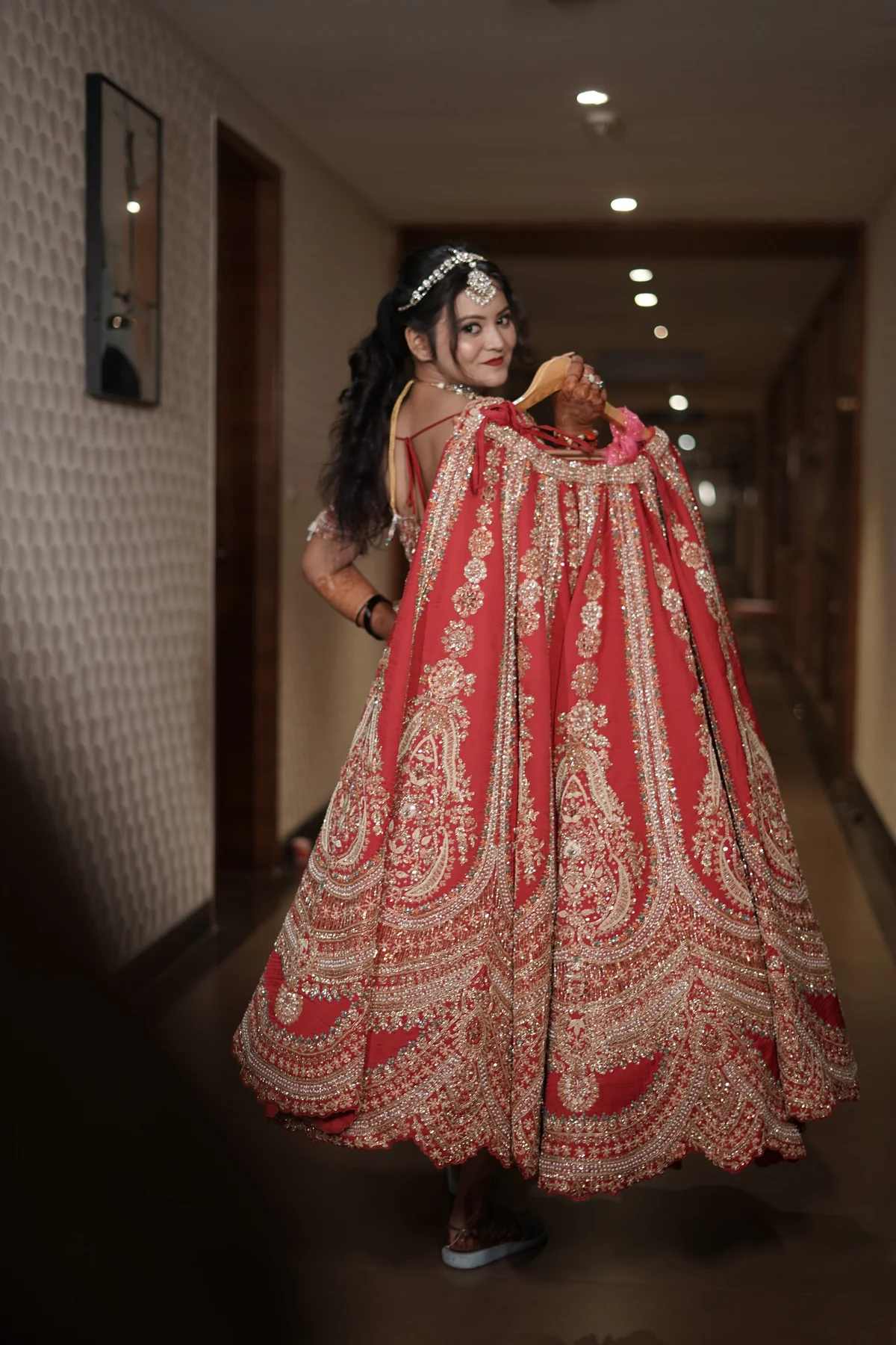 Royal Bride Twirling in Crimson Lehenga