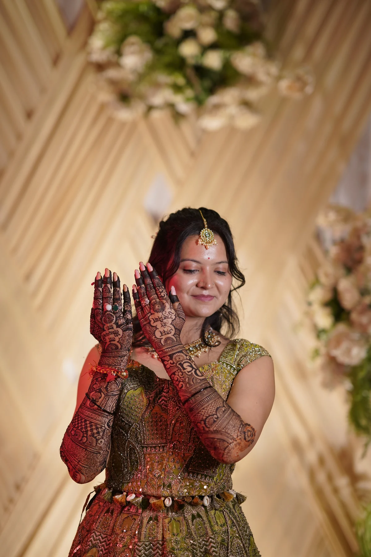Radiant Bride in Emerald Lehenga with Mehendi