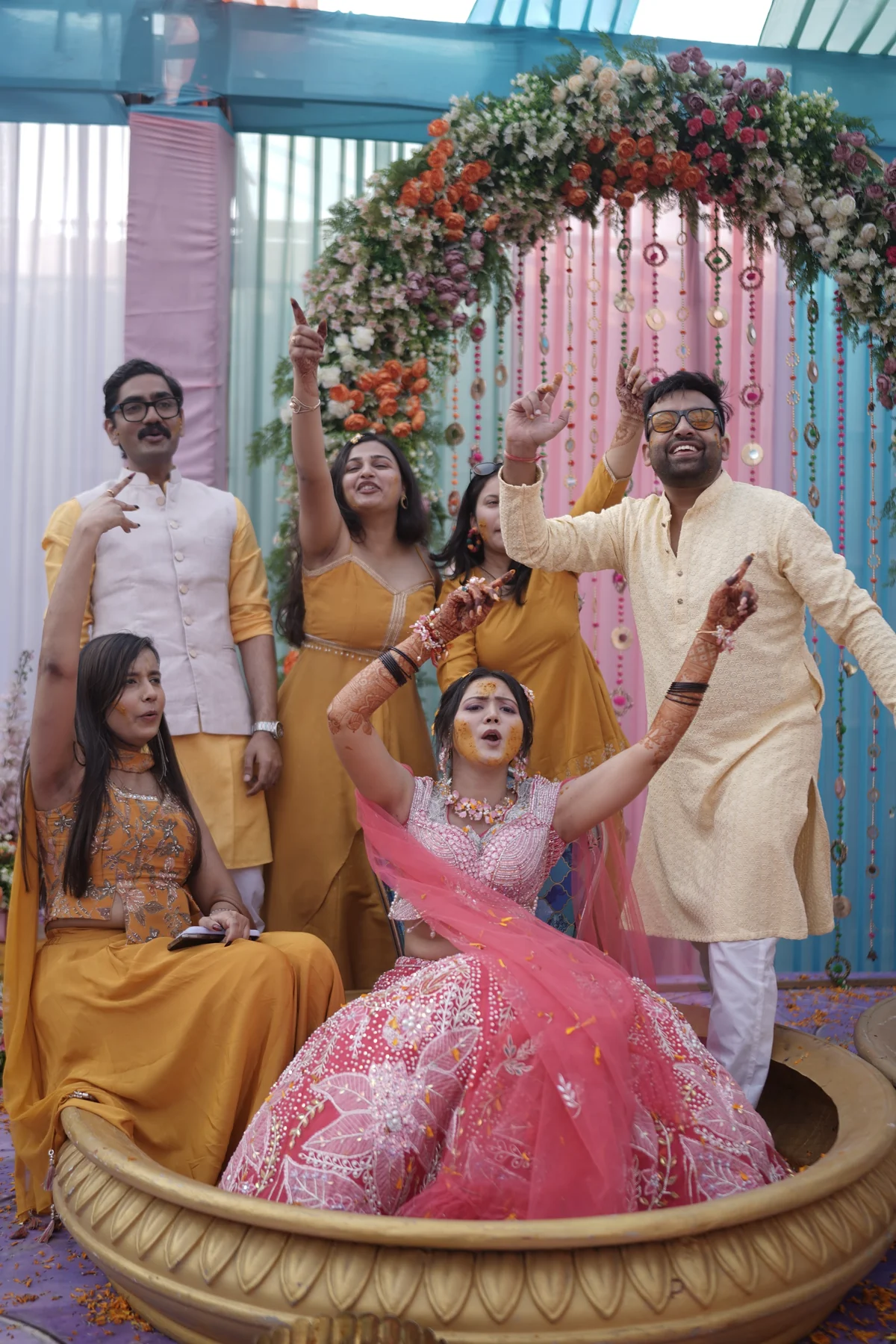 Bride Laughing Under Shower of Yellow Flower Petals