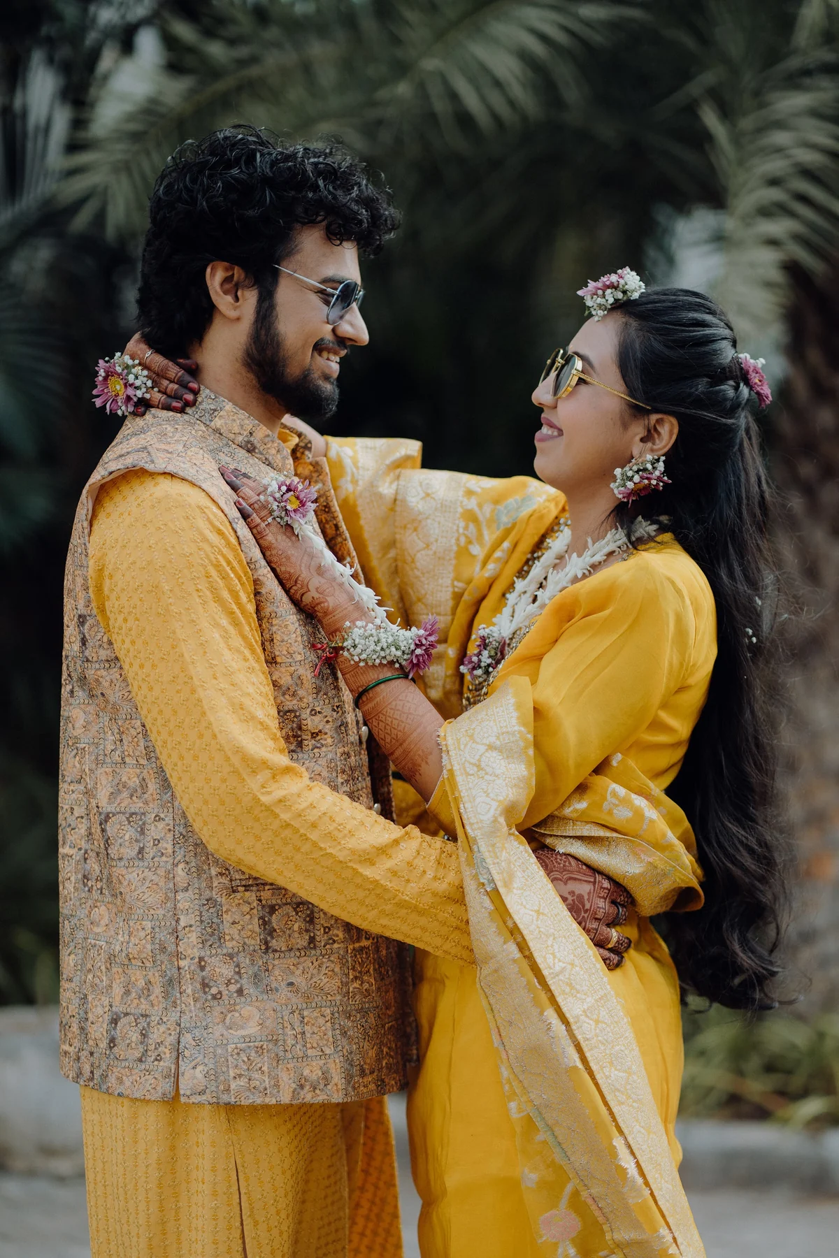 Couple Embracing in Vibrant Yellow Haldi Attire