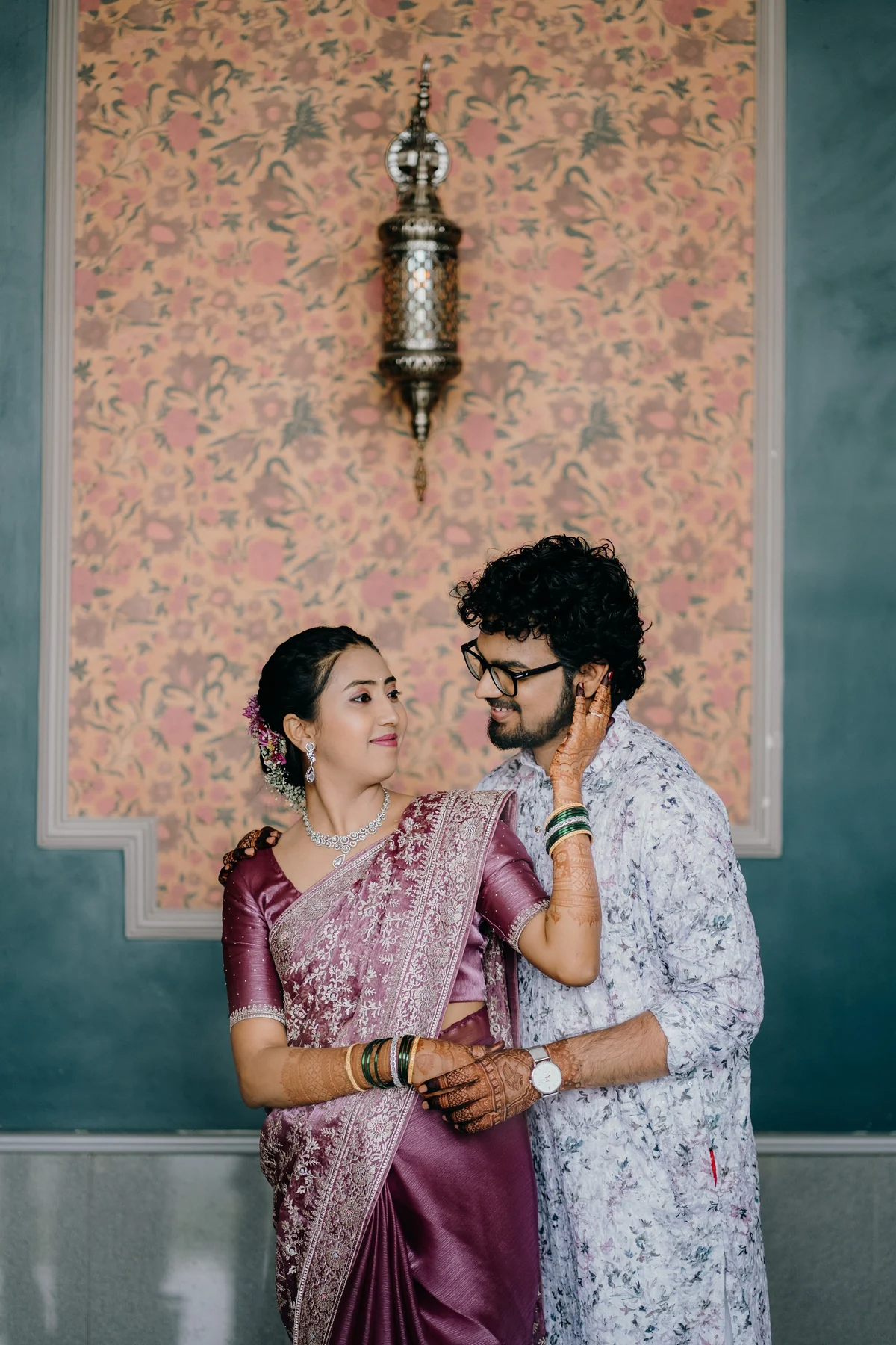 Traditional Couple Holding Vintage Lantern in Palace