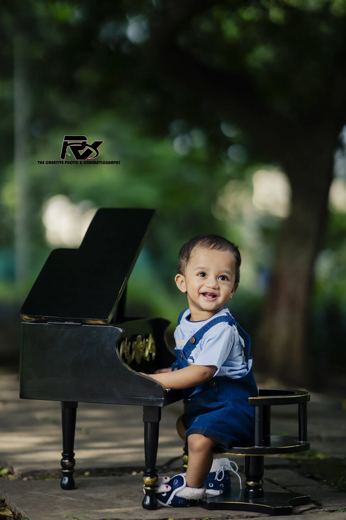 Young Boy Playing Vintage Piano in Enchanted Forest