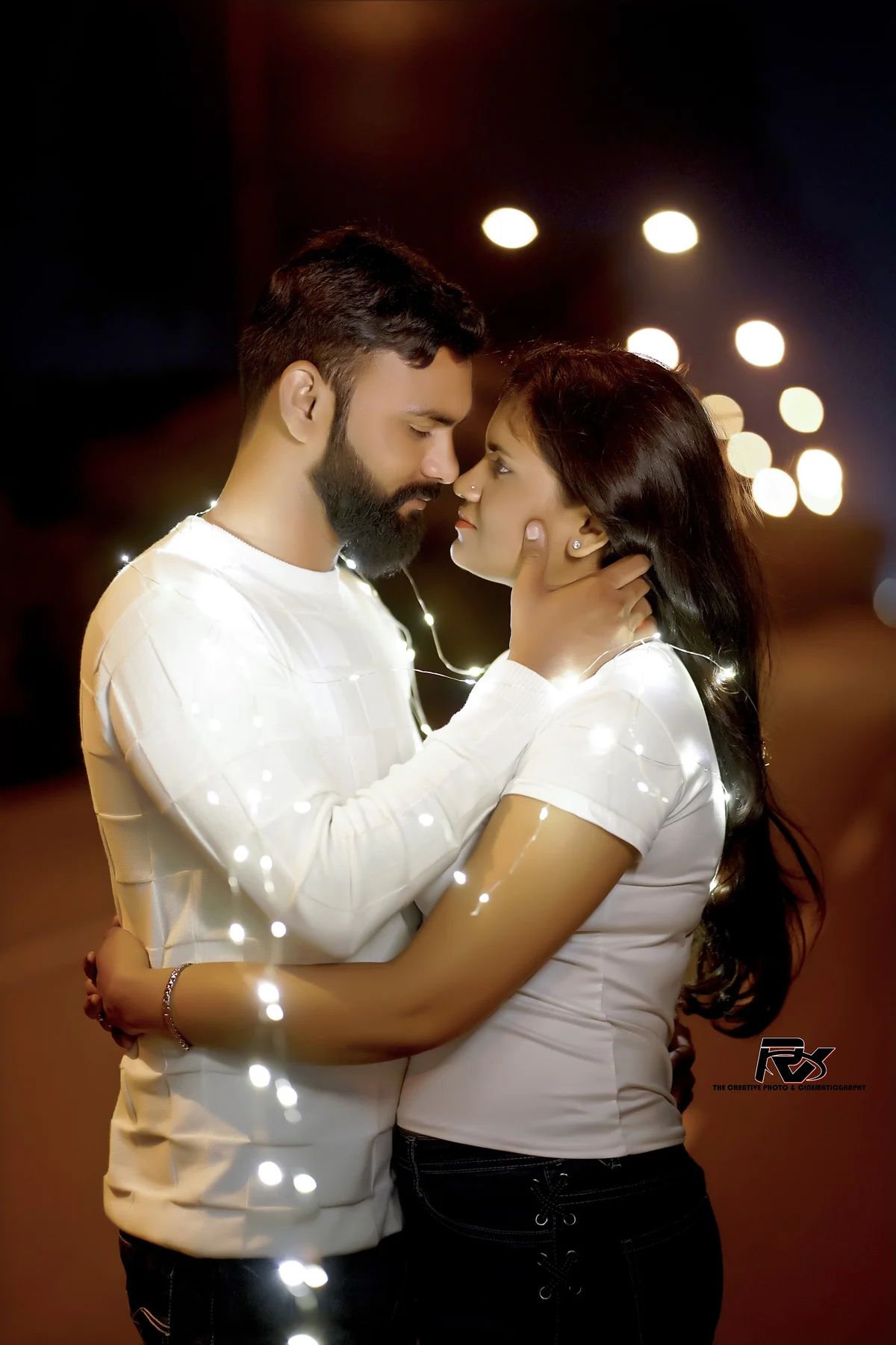 Intimate Couple Portrait Surrounded by Warm Fairy Lights