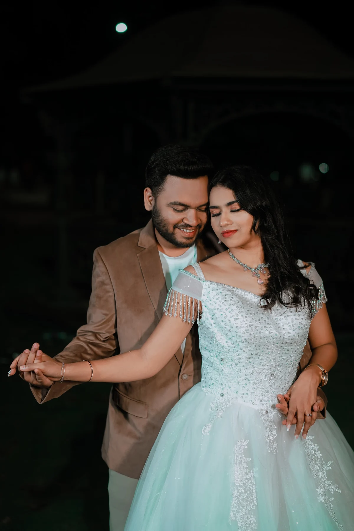 Romantic Couple Under Illuminated Night Gazebo